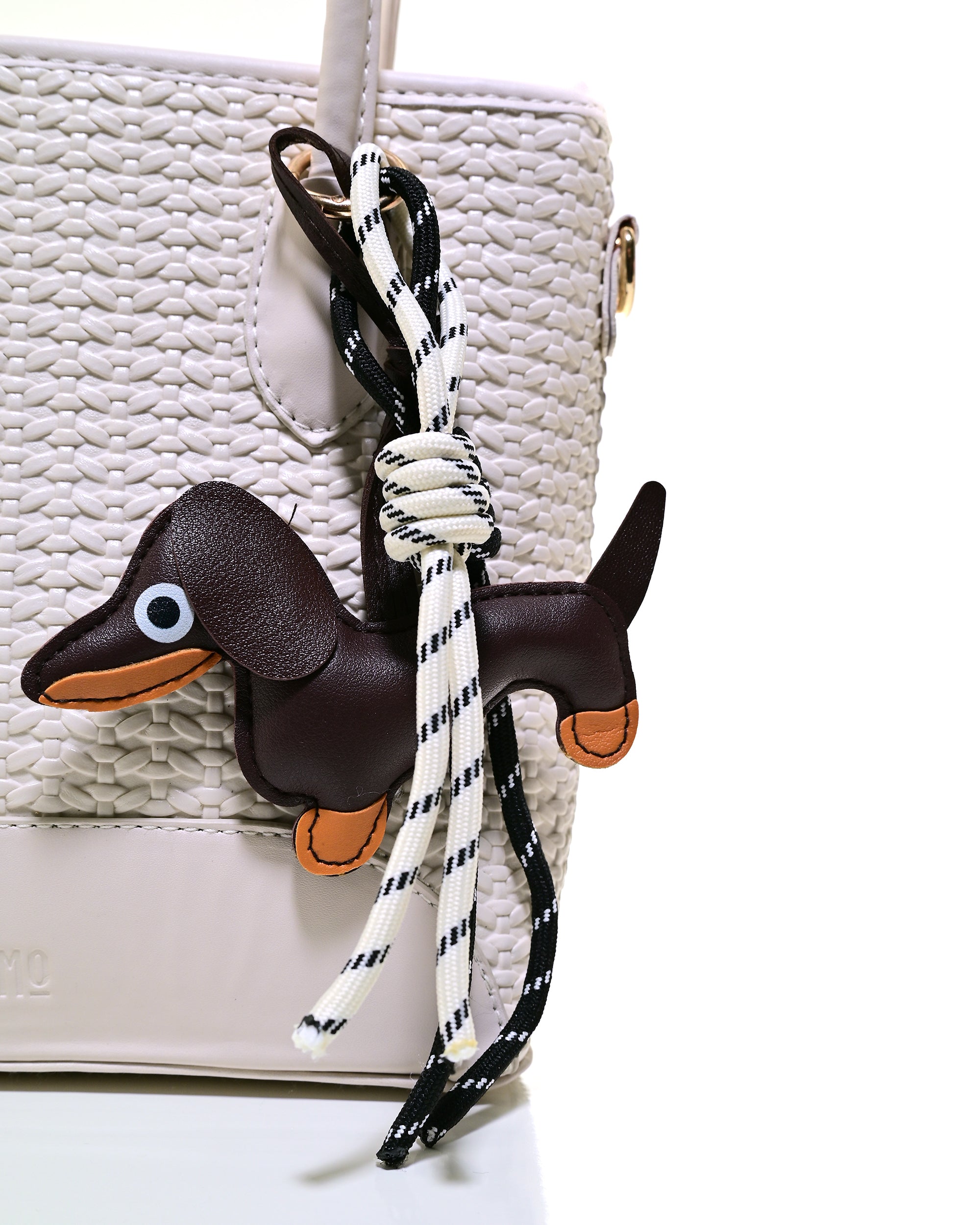 SLD013 - ELEGANT WOMEN'S WOVEN LEATHER BAG WITH PUPPY CHARM